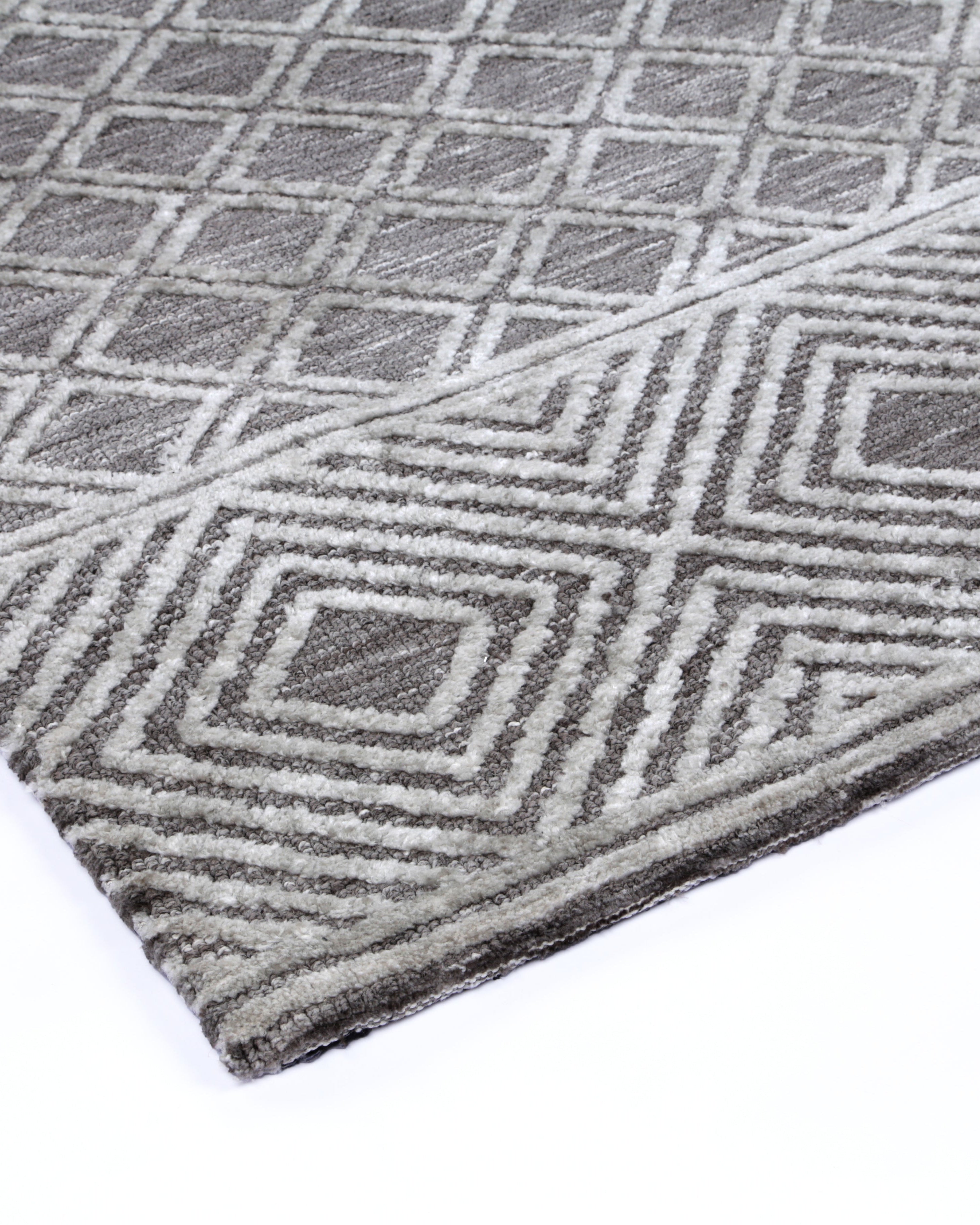 Alayah Diamond Trellis Silver Rug corner on light flooring