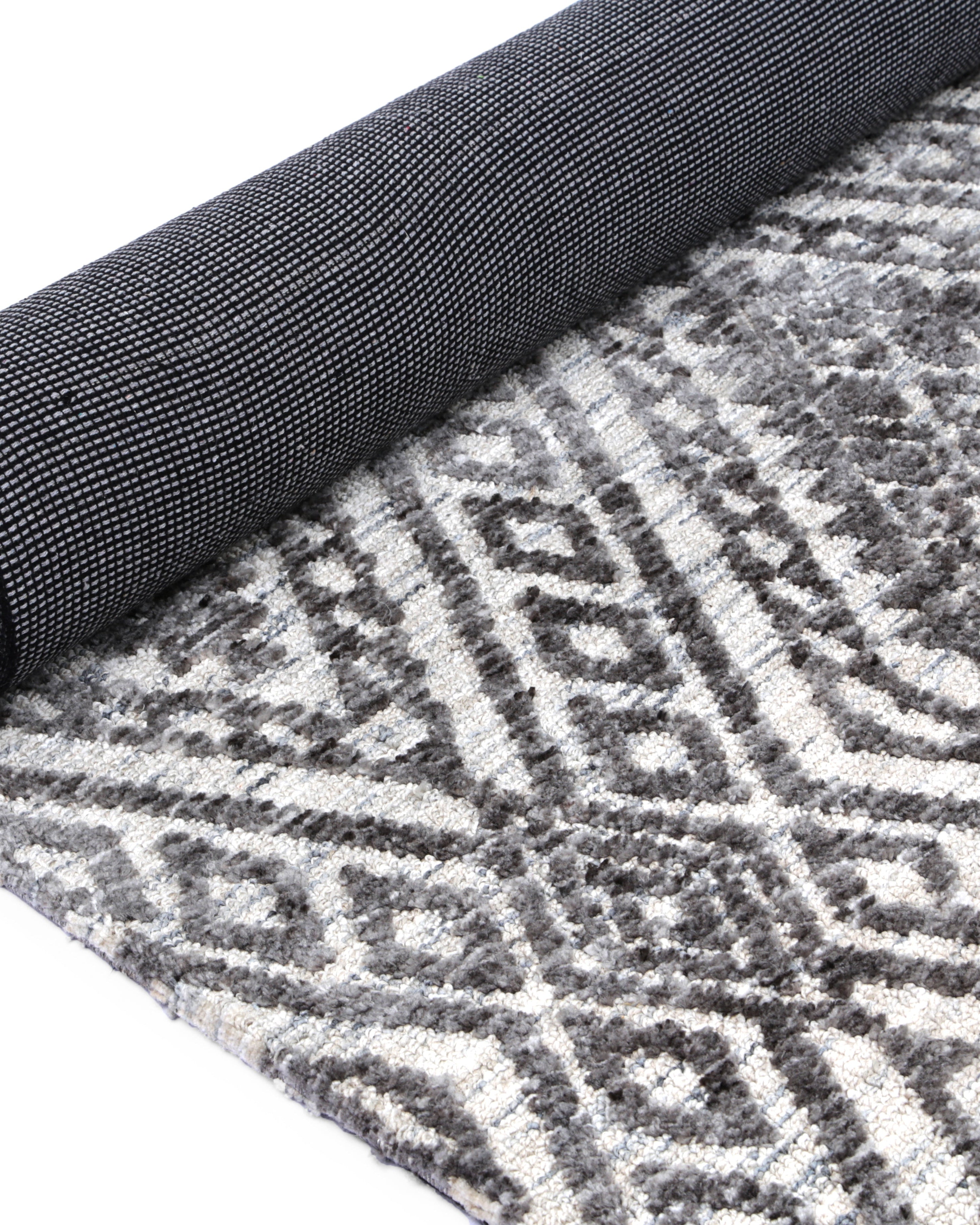 Alayah Zalij silver & taupe Rug rolled showing dark backing