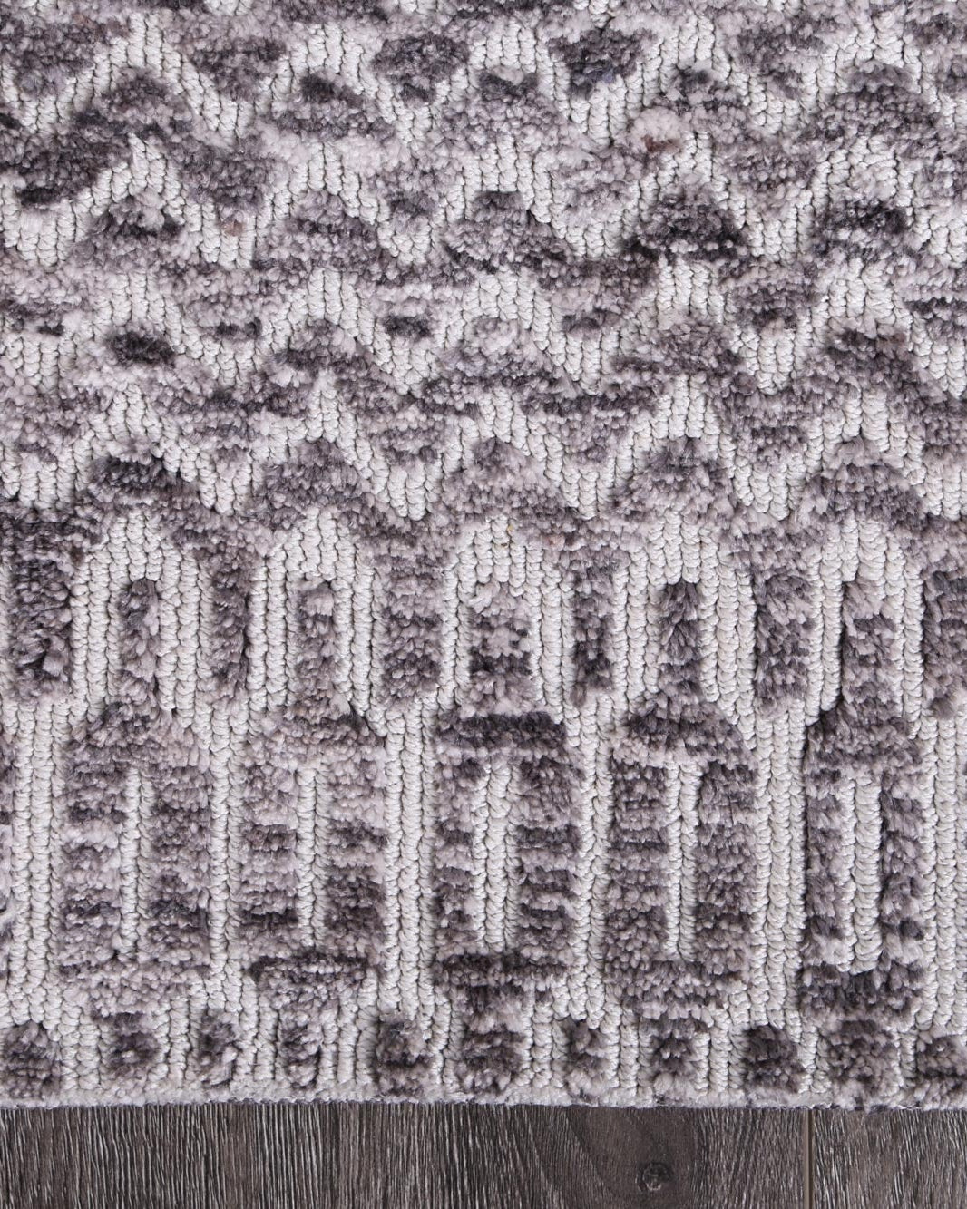 Alayah Camphils Silver Rug corner photo on dark flooring