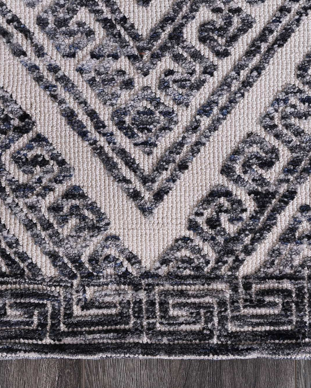 Alayah Diamond Grey Rug corner shot on grey flooring