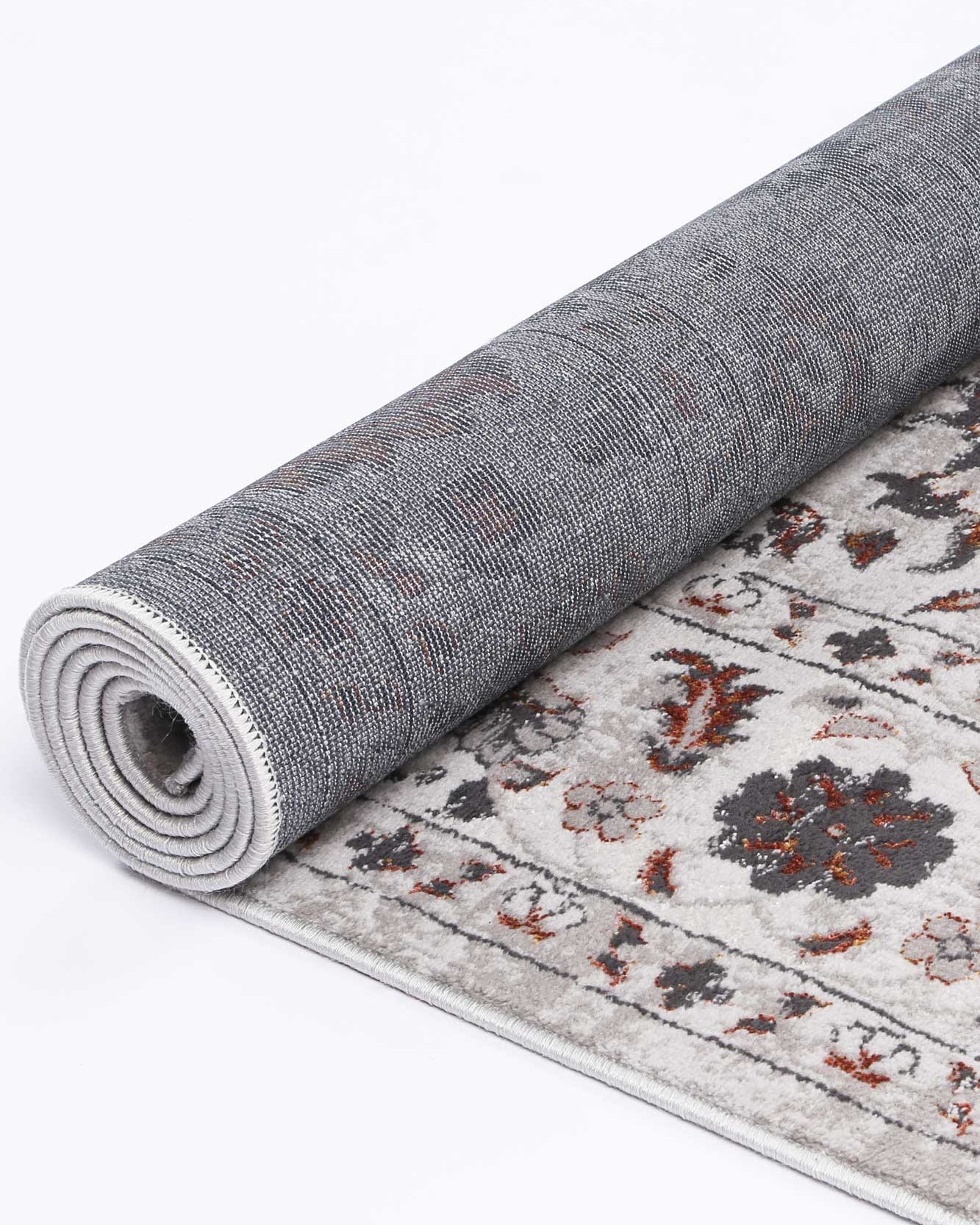 Almada Charcoal Floral Rug rolled